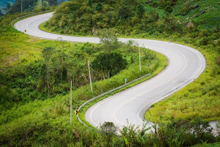 The road curves up the mountainの写真素材