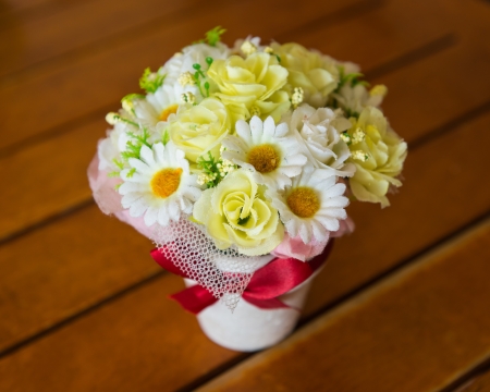 plastic flowers in potの写真素材