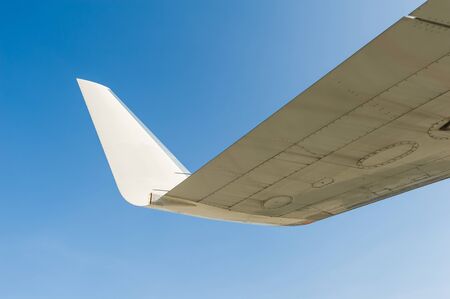 Wing airplane over blue skyの写真素材