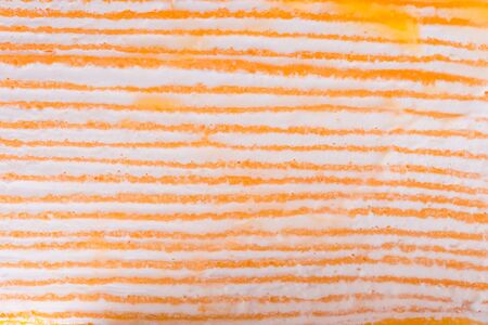 Layer of oranges cake, fruit cake on white background.の写真素材