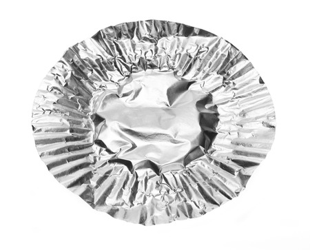 Round aluminium foil food isolated on white backgroundの写真素材
