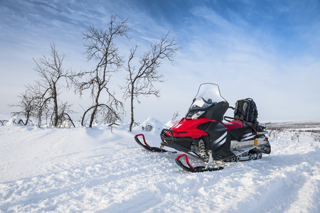 Snowmobile in snowy field