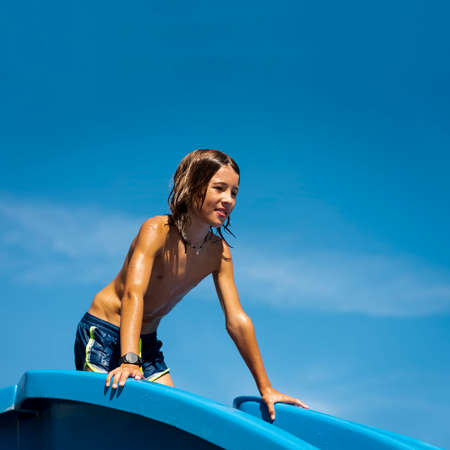 Child playing in the pool on a sunny day