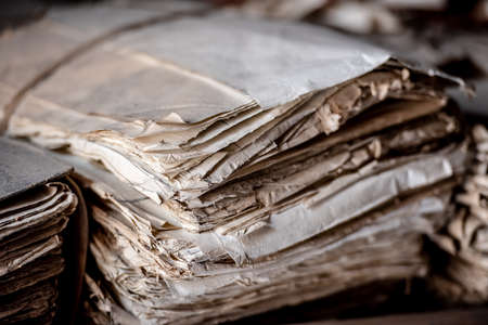 Archive of historical documents bound in files. Old paper documents in the archive. Enhancement of archival documents. Concept of discovery of the past.の写真素材