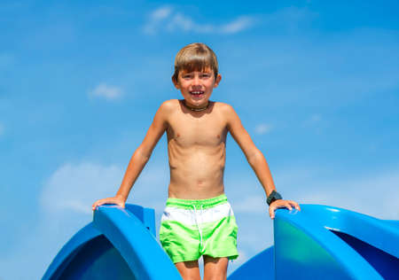 Child playing in the pool on a sunny day