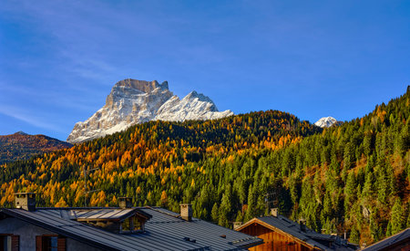 View of Monte Pelmo from S. Vito di Cadore, Belluno district, Veneto, Italy, Europe. Reflection of autumn foliage in the woods at the foot of Monte Pelmo in the Boite valley, Dolomites.の写真素材