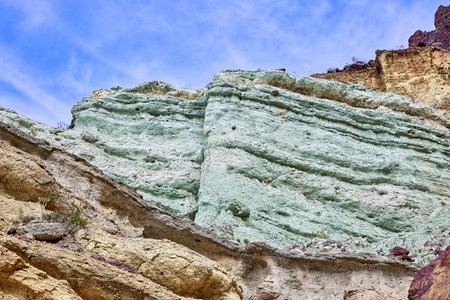 Fuente de los Azulejos de Veneguera, volcanic rocks stratified and colored by the effect of...