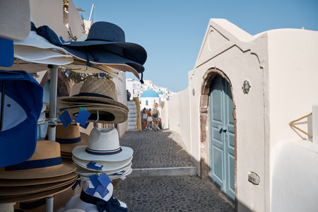 Street with shops and souvenirs for tourists in Oia, Santorini Island. Santorini is a volcanic island in the Aegean Sea and a famous summer resort.の写真素材