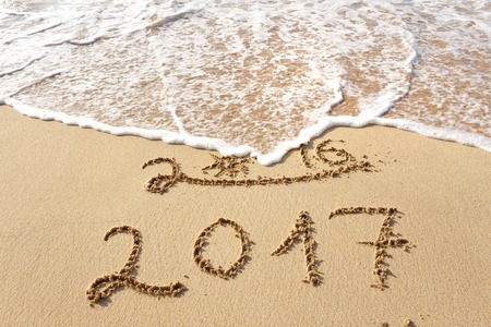 Happy New Year 2017 replace 2016 text on the sea beachの写真素材