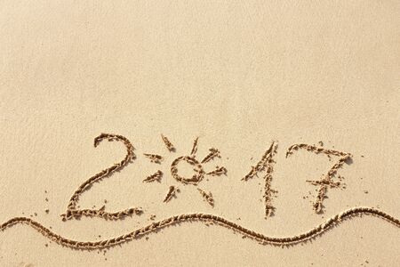 Happy New Year 2017 replace 2016 text on the sea beachの写真素材
