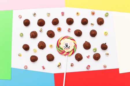 Valentines day lollipops, candy. Truffles pattern, top view flat lay of various chocolate pralines candy on white backgroundの写真素材