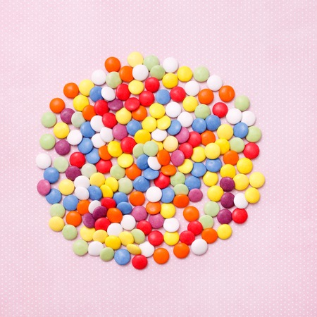 Lollipops sweets. Candy, top view flat lay on pink background. Sweet sucker, lollipop