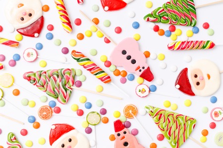 Lollipops sweets. Candy, top view flat lay on white background. Sweet sucker, lollipop, candy, food backgroundの写真素材