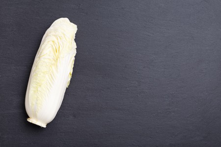 Chinese cabbage on a black stone board, black food backgroundの写真素材