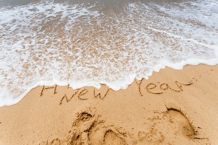 Happy New Year 2017 replace 2016, lettering on the beach