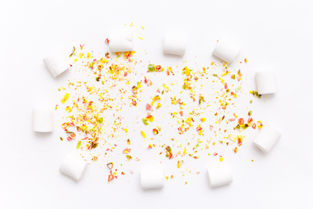 Roughly broken lollipops, candy on colorful white background, top view flat lay. Sweet sucker, lollipop, candy, isolated minimal concept above decoration, food backgroundの写真素材