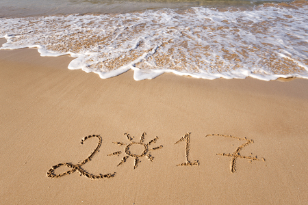 Happy New Year 2017 lettering on the beachの写真素材
