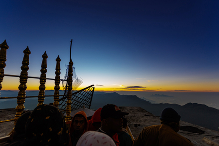 Sri Lanka, Southern Asia - February 14, 2015: Sunrise greeted pilgrims on the holy mount Adams Peak ( also Sri Pada ) is the most popular pilgrim place in Sri Lankaのeditorial素材