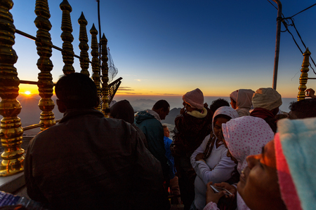 Sri Lanka, Southern Asia - February 14, 2015: Sunrise greeted pilgrims on the holy mount Adams Peak ( also Sri Pada ) is the most popular pilgrim place in Sri Lankaのeditorial素材
