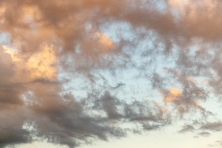 Beautiful sky with sunlight on the clouds. Nice weather.