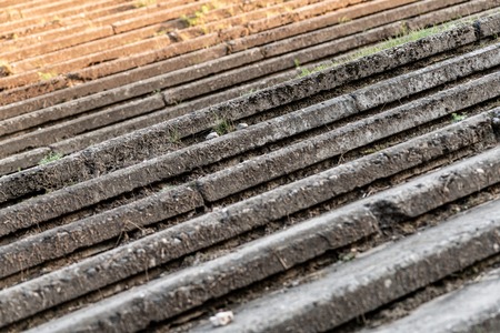 Concrete staircase overgrown with grass, without railing. Old outdoor stone steps.の写真素材