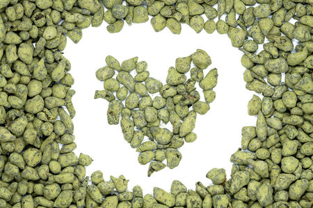 Ginseng oolong tea, heart-shaped, close up, isolated. Chinese oolong tea drink rolled in ginseng powder used for weight loss, aids digestion and health improving.の写真素材