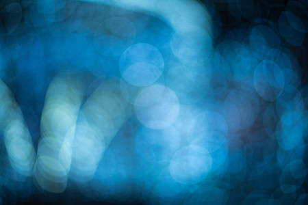 Blue bokeh blurred lights background. Garlands decoration for the new year celebration.