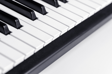 Piano keys with copy space, isolated. Piano or synthesizer keyboard. Classical music instrument for playing or composing romantic music.の写真素材