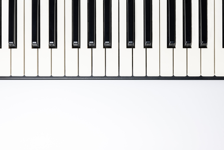 Piano keys with copy space, isolated for design, top view, flat lay. Piano or synthesizer keyboard. Classical music instrument for playing romantic music.の写真素材