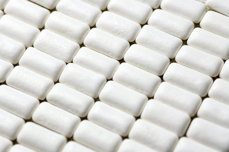 Chewing gum pads close up. Oral hygiene and teeth protect from tooth decay or plaque concept. Sugar free gums bunch during breakfast.の写真素材