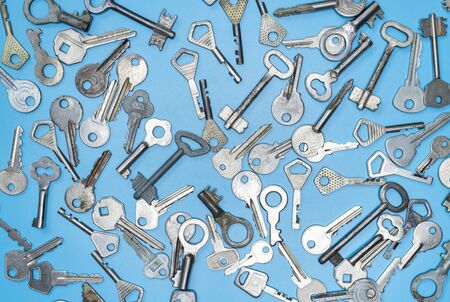 Keys set on blue background. Door lock keys and safes for property security and house protection....