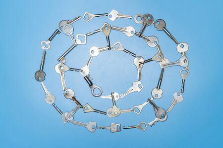 Keys set in spider web shape. Security and protection concept. Choosing a lock against thieves and...
