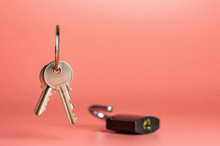 Keys and open padlock security hacking concept, copy space. Choosing the best security system at...