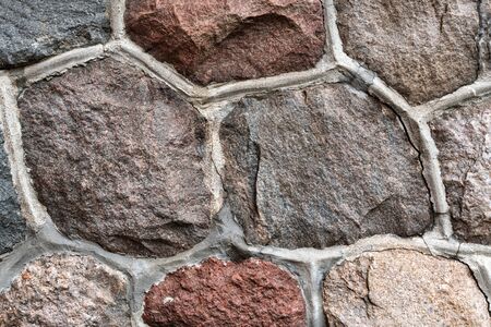 Masonry stone abstract texture on ancient foundation of cathedral. Old tile pattern.