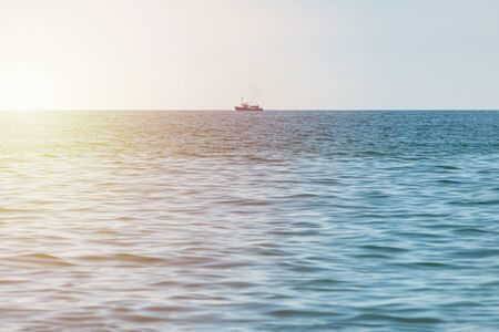Fishing ship at sea. Lonely boat trawler goes to port for sell fish catch. Calm clear sunny weather....