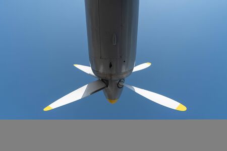 Airplane propeller of military aircraft, copy space. Blue sky sunny background.の写真素材