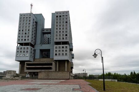 Abandoned high-rise building, cloudy weather, copy space. Unfinished shell construction. House of Soviets in Kaliningrad, Russia.の写真素材