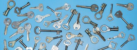 Keys set on blue background. Door lock keys and safes for property security and house protection....