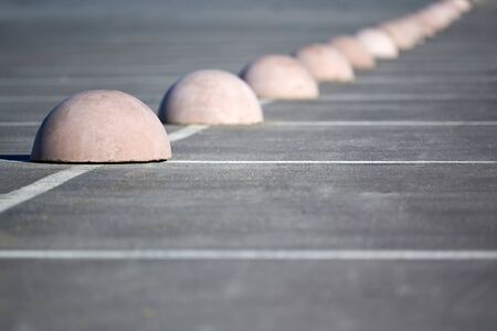 Parking hemispheres. Concrete parking limiter. Protection from car parking. Elements to restrict access to parking zone and control movement of vehiclesの写真素材
