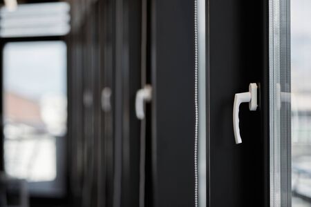 Windows row in office building. Modern windows with handles. Rows of windows in new apartment.