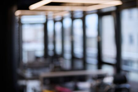 Modern office blurred background. Large corporation workplaces in open space office. Soft focusの写真素材