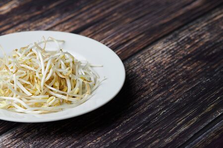 Mung bean sprouts in plate. Raw organic healthy food. Traditional vegetable dish in east Asia.の写真素材