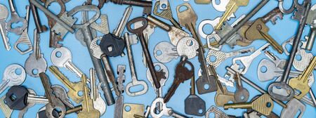 Keys set on blue background. Door lock keys and safes for property security and house protection....