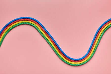 Braided nylon ropes waves shape. Red, green, blue and yellow rope. Strong and reliable fastening for...