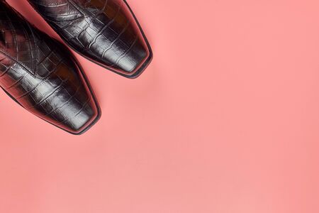 Woman shoes, copy space, pink background. Shoe care or clearance sale concept.の写真素材