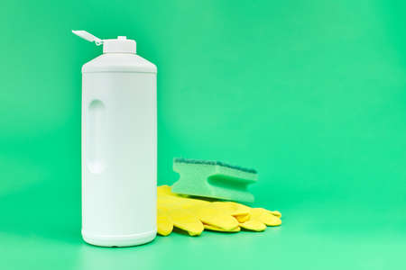 Kitchen detergent with sponge and gloves. Cleaning, housekeeping and washing dishes. Minimal...
