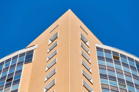Multistorey building. Rhythm in photography. Multi-storey facade, windows and block of flats, close...