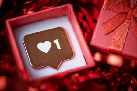 Like symbol in red gift box. Like sign heart button, symbol with heart and one digit. Social media...