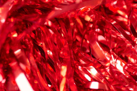 Party red tinsel, holiday background. Gift box decorative filler. Colorful backdrop design for advertising.の写真素材