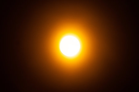 Abstract light background. Yellow blured trail lights, strips and bokeh. Beautiful motion painting. Long exposure photographyの写真素材